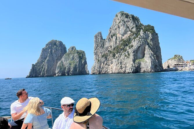 Capri, Blue Grotto by Priority, Faraglioni Swim and City Visit - Spiaggia Grande and Bagni di Tiberio: the Roman coastline intro