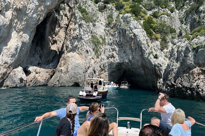 Capri, Blue Grotto by Priority, Faraglioni Swim and City Visit - The Punta Carena lighthouse at sunset angle