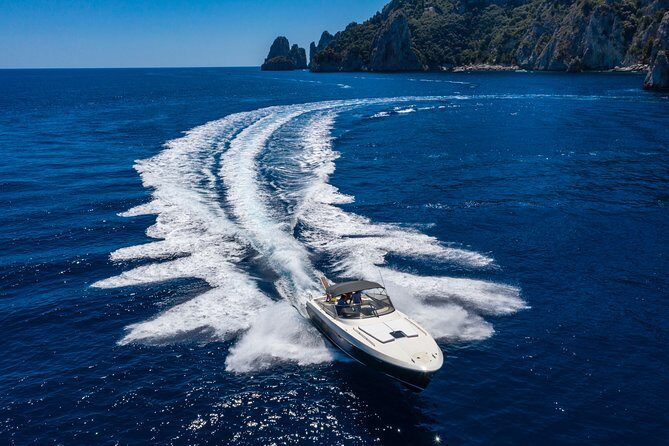 Capri & Positano Tour - Faraglioni arch at sea: the classic Capri moment