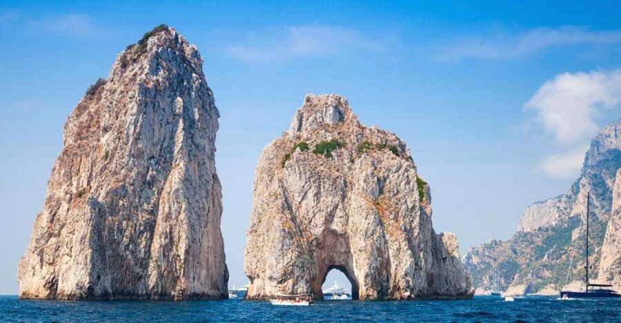 Capri Private Full-Day Boat Tour from Sorrento - Faraglioni and Punta Carena: postcard icons with real sea-level drama