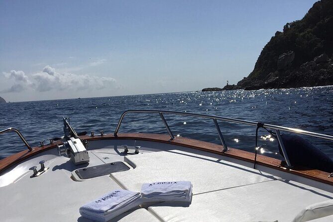 Exclusive Boat Tour to Capri with Swim Stop and Aperitif - Coastline cruise from east to west: Green Grotto, Natural Arch, Punta Carena
