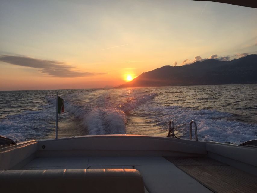 From Amalfi: Private Sunset Cruise along the Amalfi Coast - Positano at sunset: cliffs, distance, and that last golden look