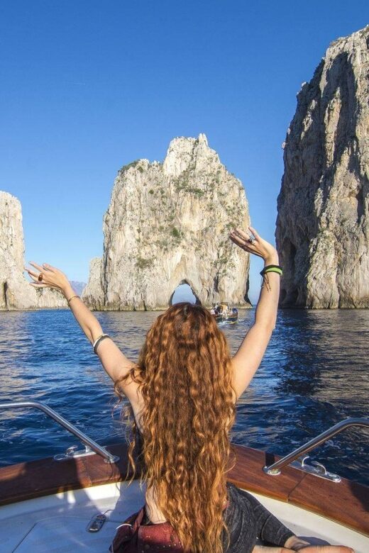 From Positano: Full-Day Boat Trip to Capri - Capri from the sea: grottos, Faraglioni, and the big-name stops
