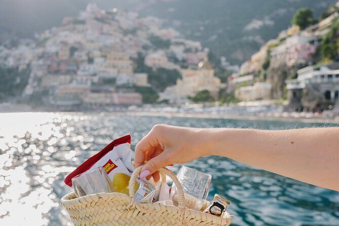 Small Group Tour from Amalfi by Boat at Sunset - Amalfi from the water: color, boats, and that bell tower look different