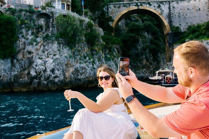 Small Group Tour from Amalfi by Boat at Sunset - On board experience: stories, music, and the included prosecco moment