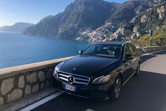 Sorrento transfer to Naples (stop Pompeii option) or vice versa - The driver meet-up: name sign, formal dress, and real help with luggage