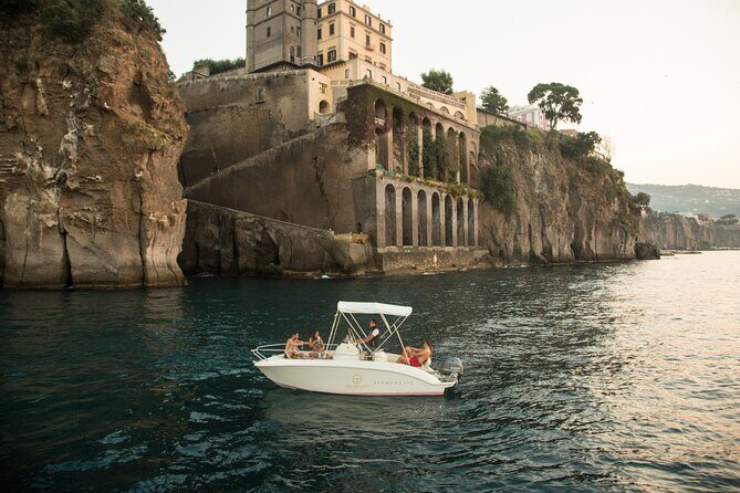 The Blue Dream: Capri Boat Tour from Sorrento - A lighthouse and Bourbon-era fort views from the sea